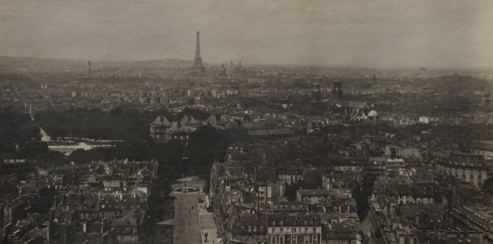 The Story of the Eiffel Tower: From Controversy to the World’s Most Visited Monument 1 Vintage aerial view of Paris with the Eiffel Tower at the center